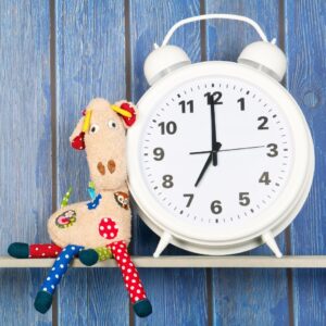 a toy and alarm clock set to 7