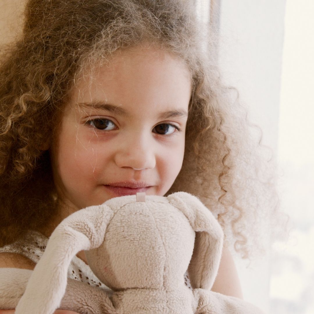 Child holding a toy.